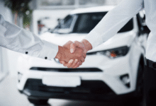 Car owner selling used car to buyer, illustrating how to sell used car effectively.