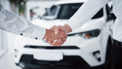 Car owner selling used car to buyer, illustrating how to sell used car effectively.